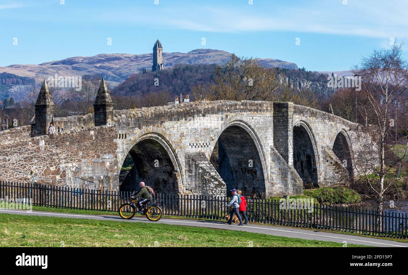 Stirling Old Bridge over the River Forth, with the Wallace Monument visible in the background, in the city of Stirling in Scotland Stock Photo