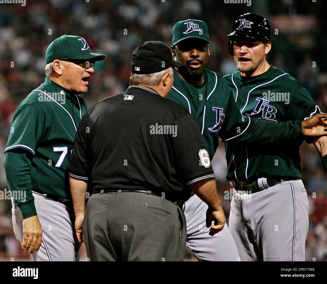 Tampa Bay Devil Rays manager Joe Maddon, left, first base coach