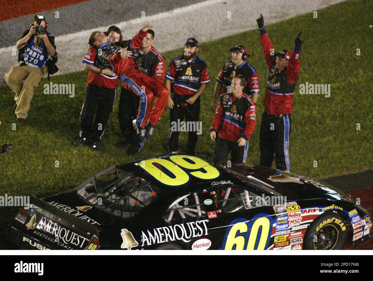 Driver Carl Edwards does a black flip Saturday, May 27, 2006, after winning the Carquest Auto