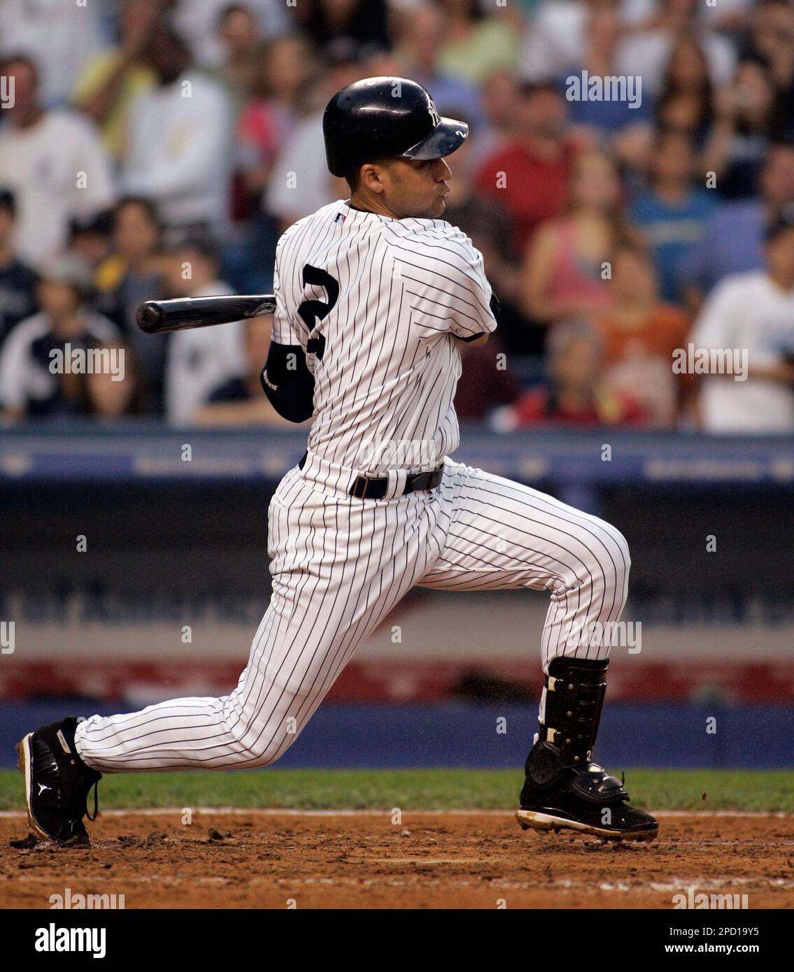 New York Yankees' Derek Jeter hits a single against the Kansas City Royals during the fourth