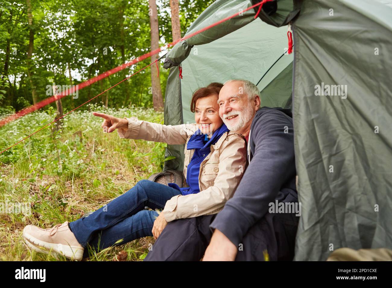 Happy caucasian woman camping sitting hi-res stock photography and ...