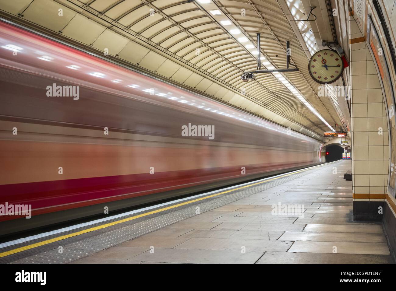 Train arriving at platform of London Underground tube (Gants Hill