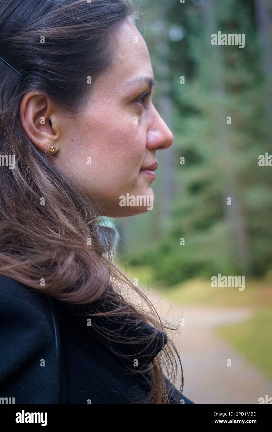 Side view of thoughtful young woman looking away Stock Photo