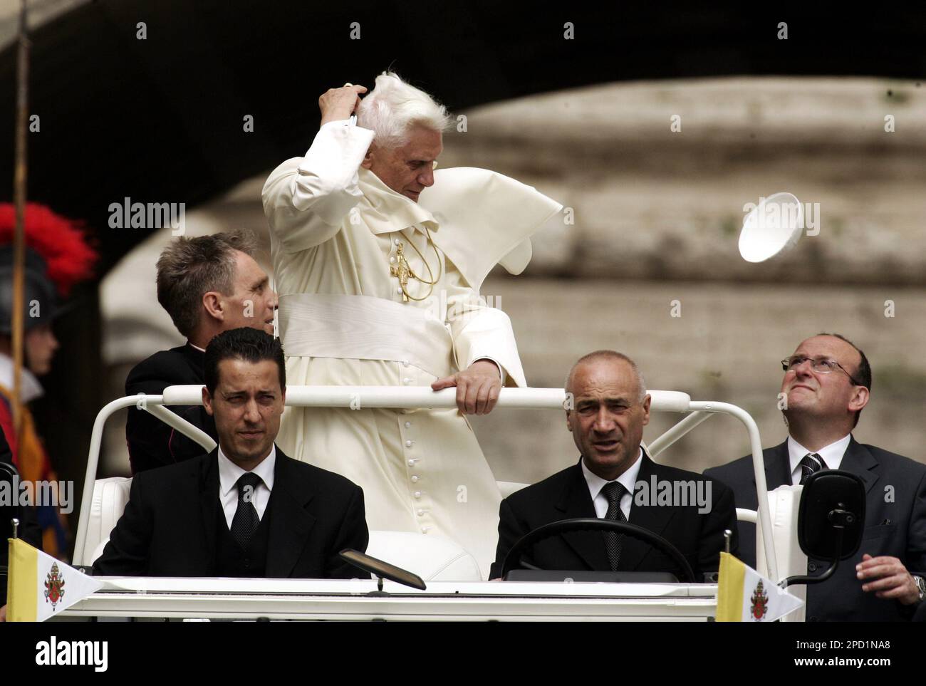 Pope Benedict XVI's skull cap is blown away in a gust of wind prior to his  weekly general audience in St.Peter's Square at the Vatican, Wednesday, May  24, 2006. The pontiff leaves