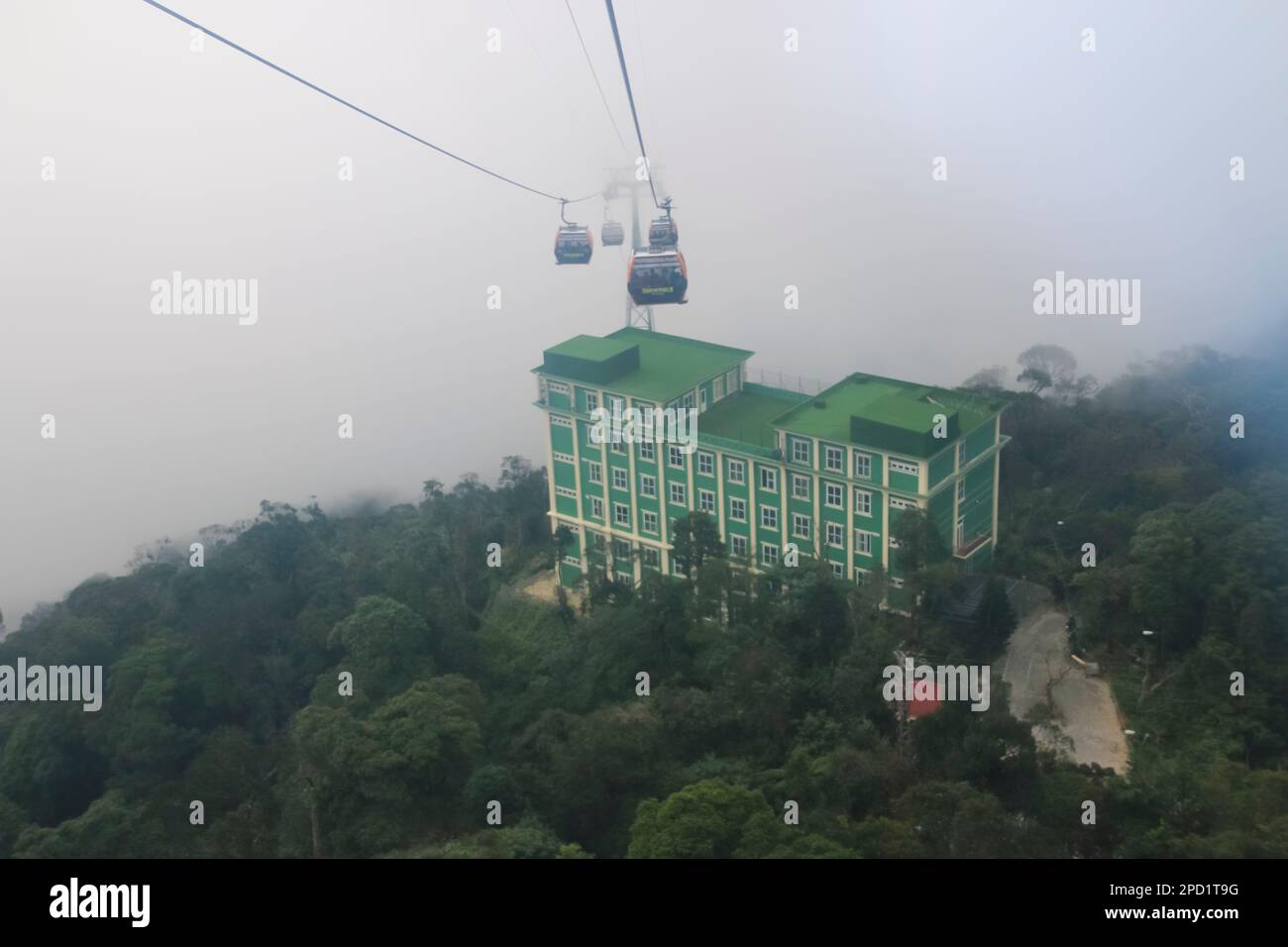 Cable Car in the fog, Sun World is the amusement Park at the top of Ba Na Hills, Danang, Da Nang, Vietnam Stock Photo