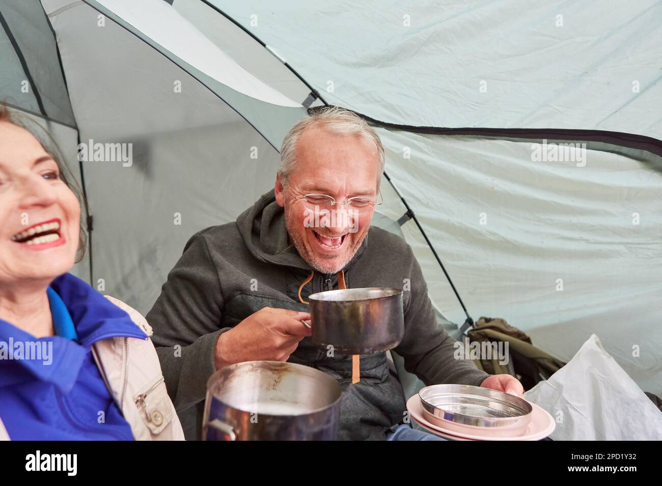 Camping sitting couple laughing hi-res stock photography and images - Alamy