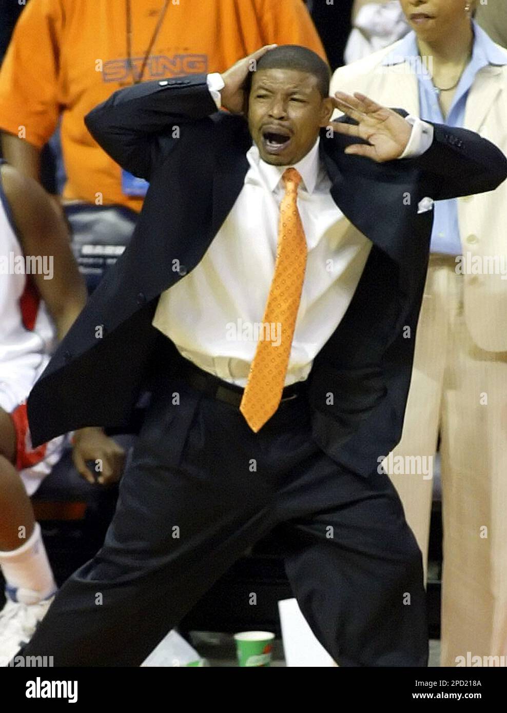 Charlotte Sting coach Muggsy Bogues reacts after a foul was called on a