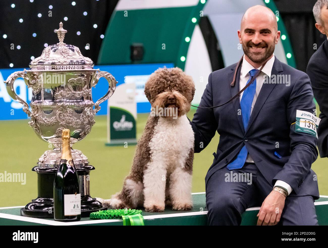 Javier Gonzalez Menicote from Croatia with Lagotto Romangnolo Orca Best In Show Winner,owned by Sabina Zdunić Šinković and Ante Lucin during Crufts - The World's Greatest Dog Show National Exhibition Centre Birmingham Sunday March 12 2023photo by Chris wynne Stock Photo