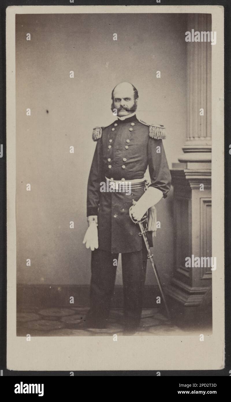General Ambrose E. Burnside of 1st Rhode Island Infantry Regiment and General Staff U.S. Volunteers Infantry Regiment with gauntlets and sword. Title devised by Library staff. Burnside, Ambrose Everett, 1824-1881, Generals, Union, 1860-1870, Military uniforms, Union, 1860-1870, Daggers & swords, 1860-1870, United States, History, Civil War, 1861-1865, Military personnel, Union. Stock Photo