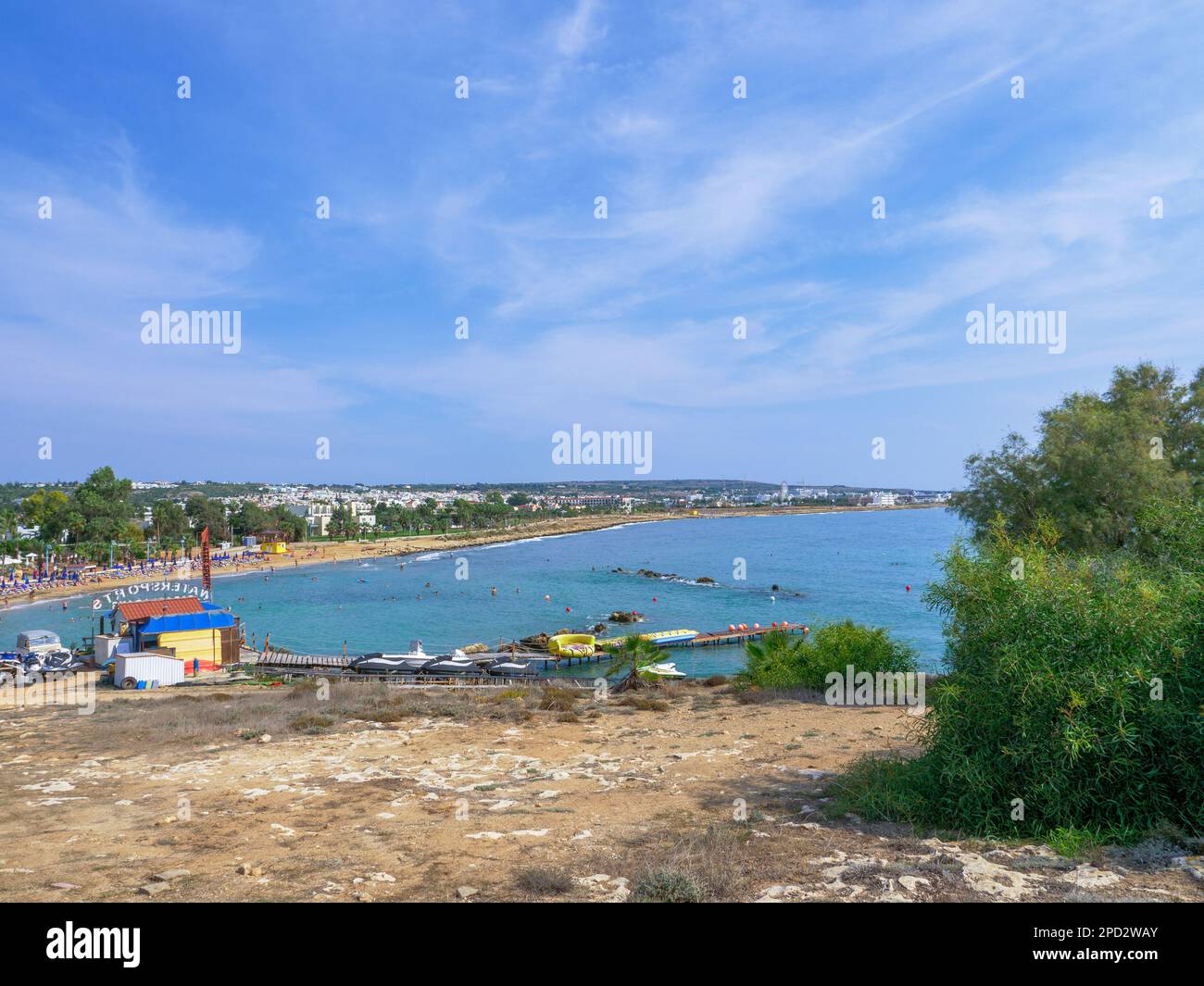 Water sports station with powerboats and water scooters near ponton going from high shore into the mediterranean sea in Ayia Napa, Cyprus. Stock Photo