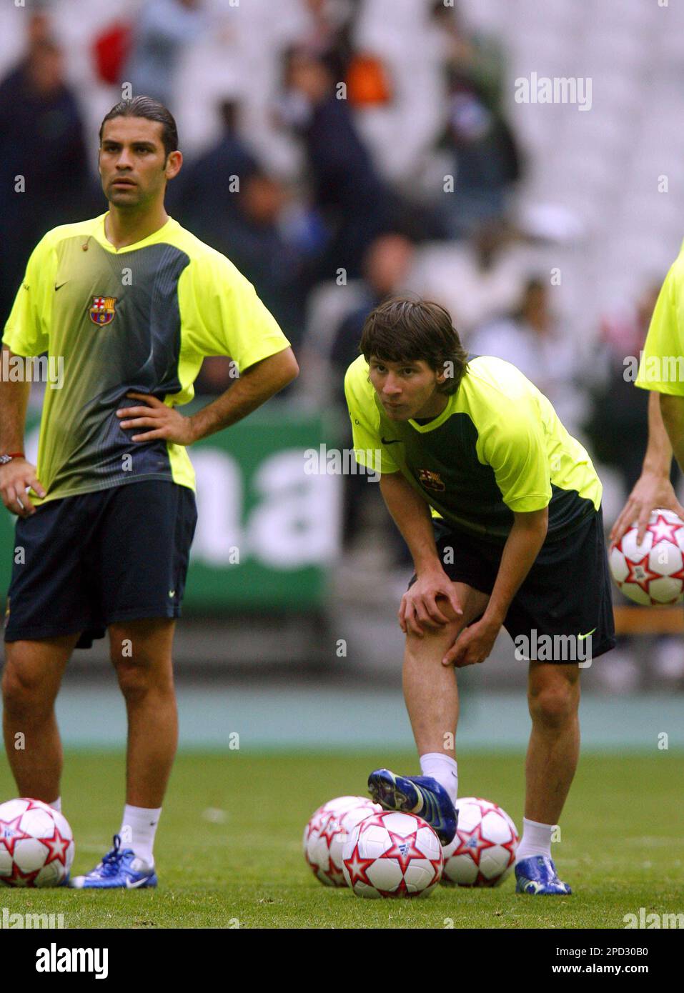 Barcelona's Argentine soccer star Lionel Messi, right, and
