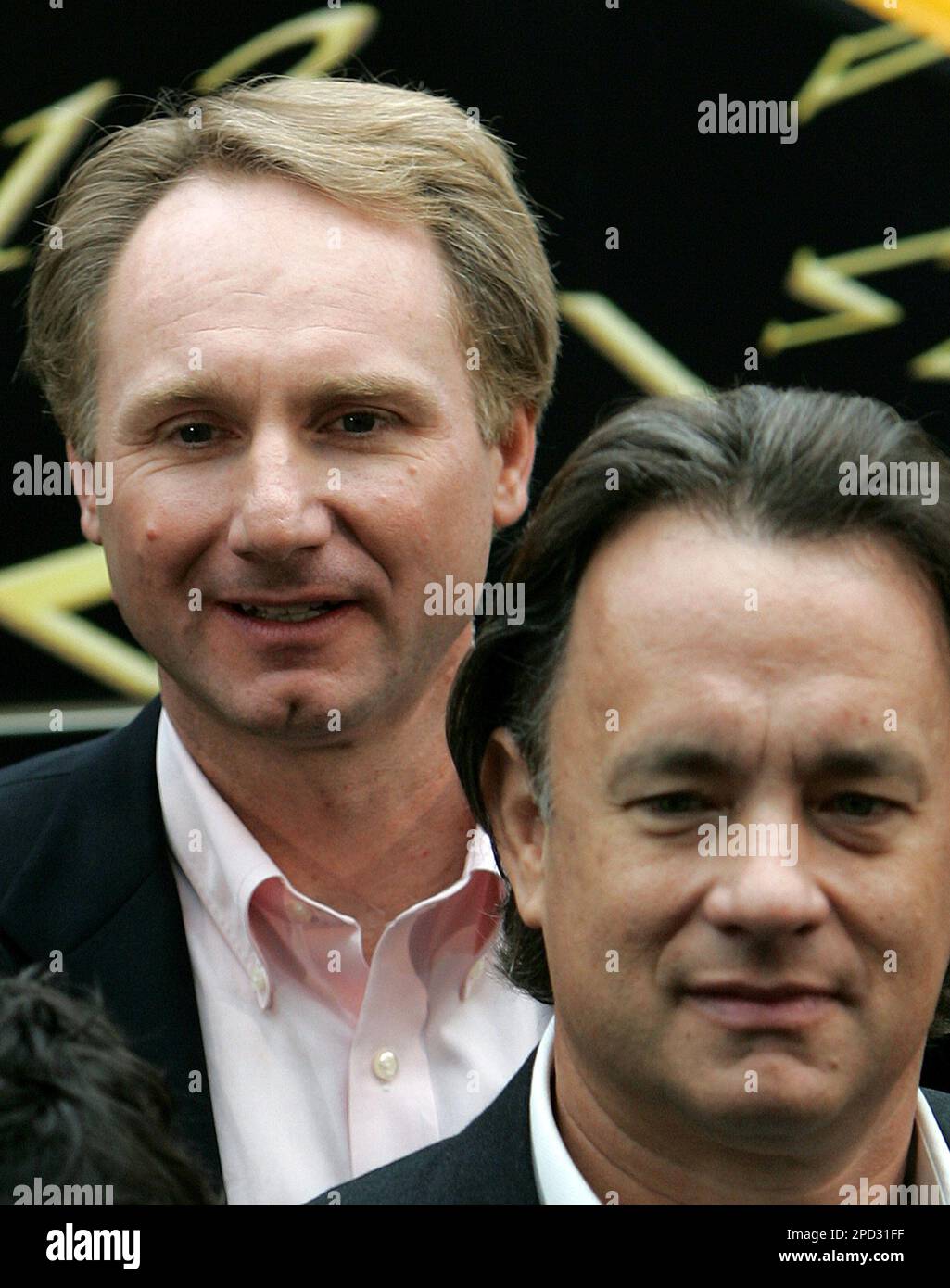 Author Dan Brown stands with U.S. actor Tom Hanks, right, following the  naming of a Eurostar train 'The Da Vinci Code' at Waterloo Station in  London, Tuesday May 16, 2006. Tom Hanks