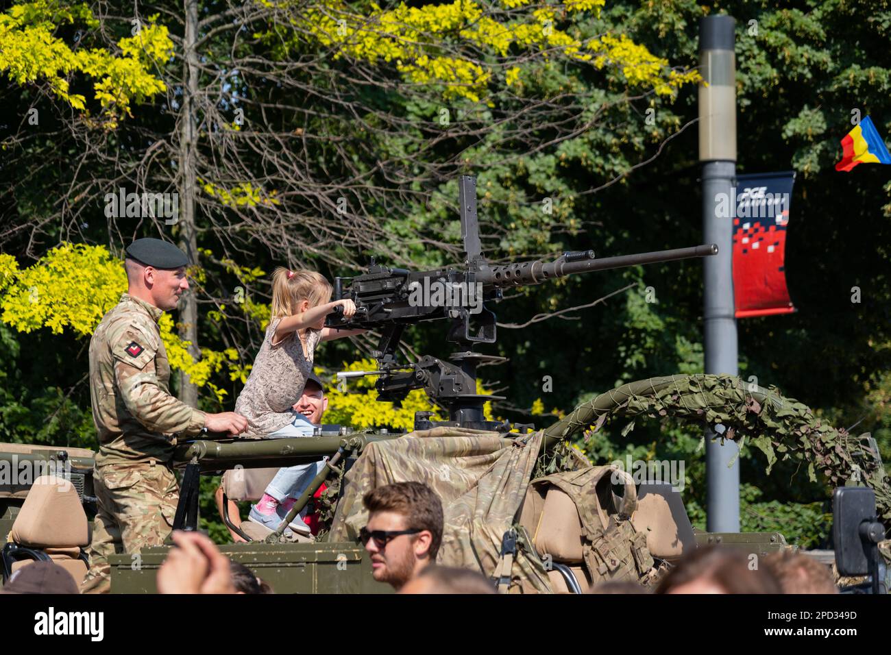 Warsaw, Poland - August 14, 2022 - Soldier and girl with 12.7mm heavy machine gun on Jackal armoured reconnaissance vehicle during Polish Army Day (Ar Stock Photo