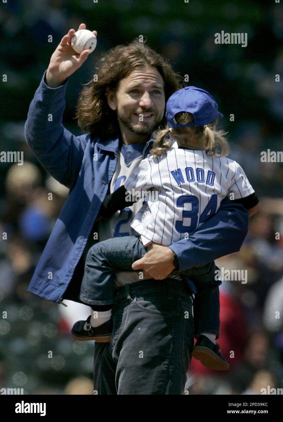 Pearl Jam frontman Eddie Vedder holds his young daughter, Olivia