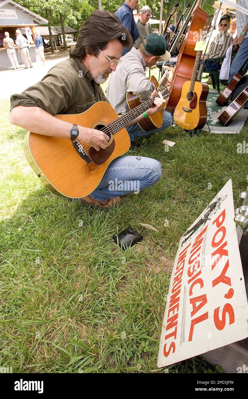 Chuck Bell of Charlotte N.C. samples a 1951 Martin D 28 guitar