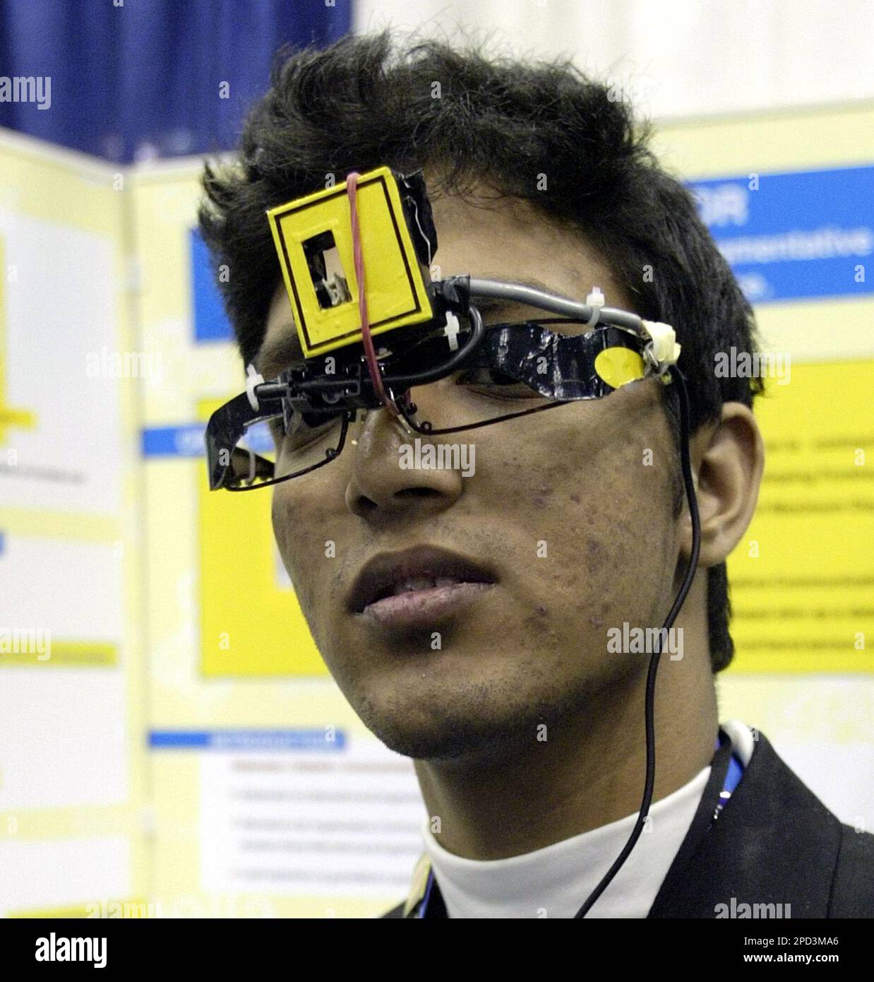 Apurv Mishra, a 16 year old from India, demonstrates a device he 