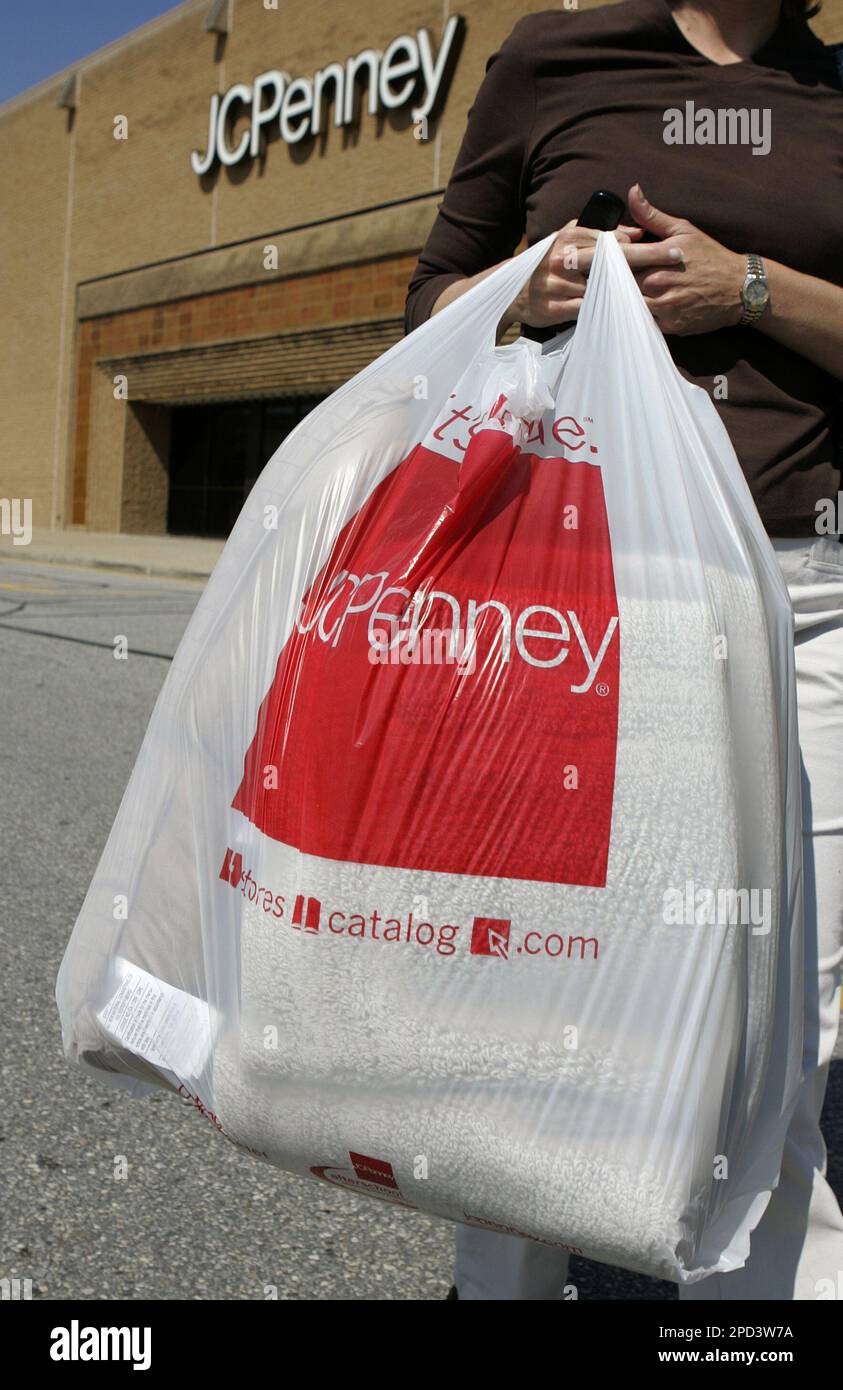 Shopper Deborah Casey of Landenberg, Pa., carries a full shopping