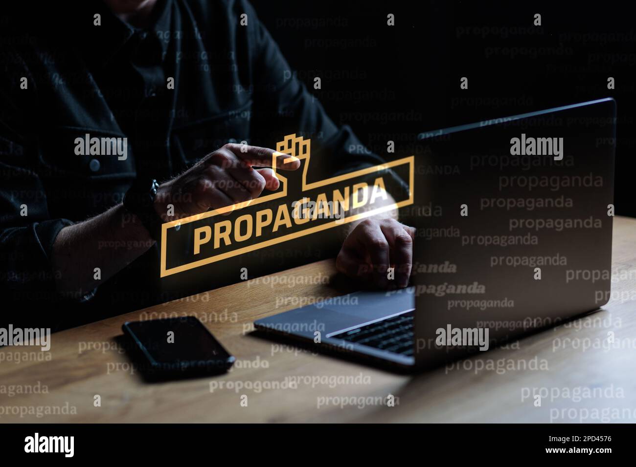 Propaganda visual concept. Man points finger at Propaganda text. High quality photo Stock Photo