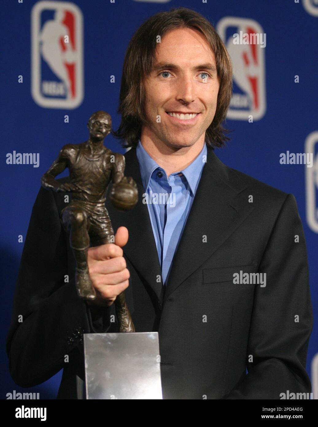 Phoenix Suns guard Steve Nash, of Canada, clutches the Maurice Podoloff