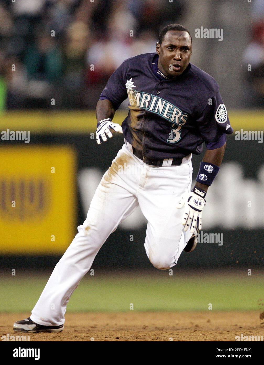Seattle Mariners' Yuniesky Betancourt rounds second base as he advances