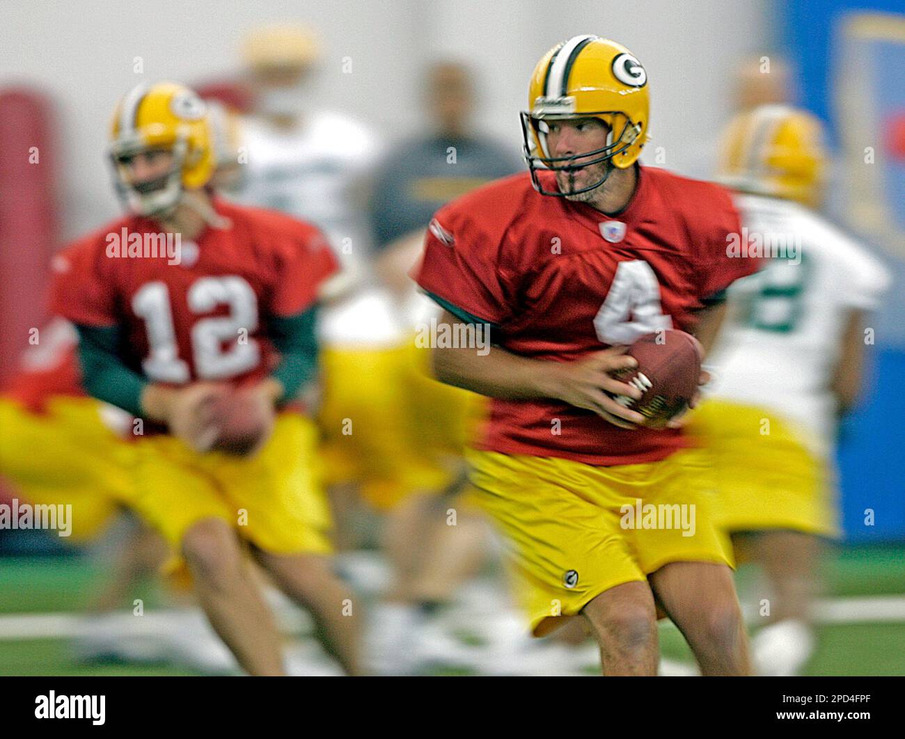 Green Bay Packers quarterbacks Brett Favre (4) and Aaron Rodgers (12