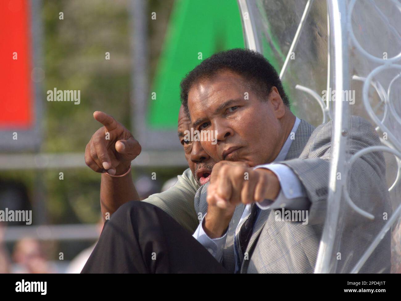 Muhammad Ali throws punches for spectators during the 2006 Kenucky