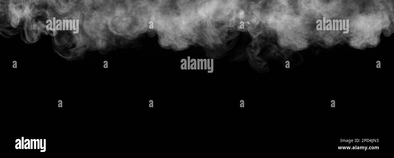 Panorama of steam, smoke, gas isolated on a black background. Swirling, writhing smoke to overlay on your photos. Smoky banner Stock Photo
