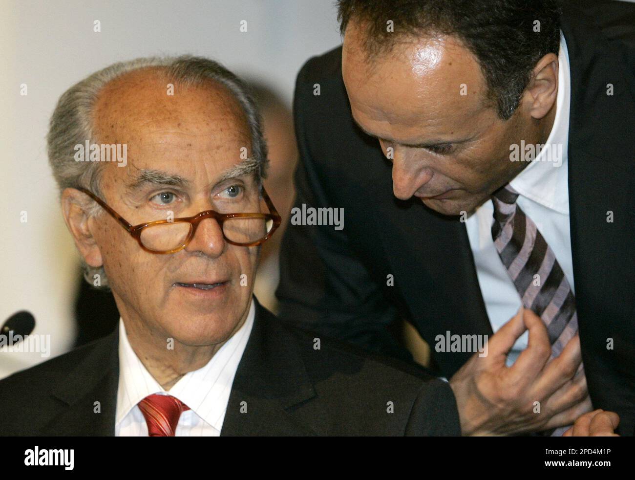 Bruno Saelzer, right, CEO of Hugo Boss AG, talks with Giuseppe Vita from  Italy, chairman of the supervisory board, during the shareholders' meeting  of the concern in Stuttgart, southwestern Germany, Thursday, May