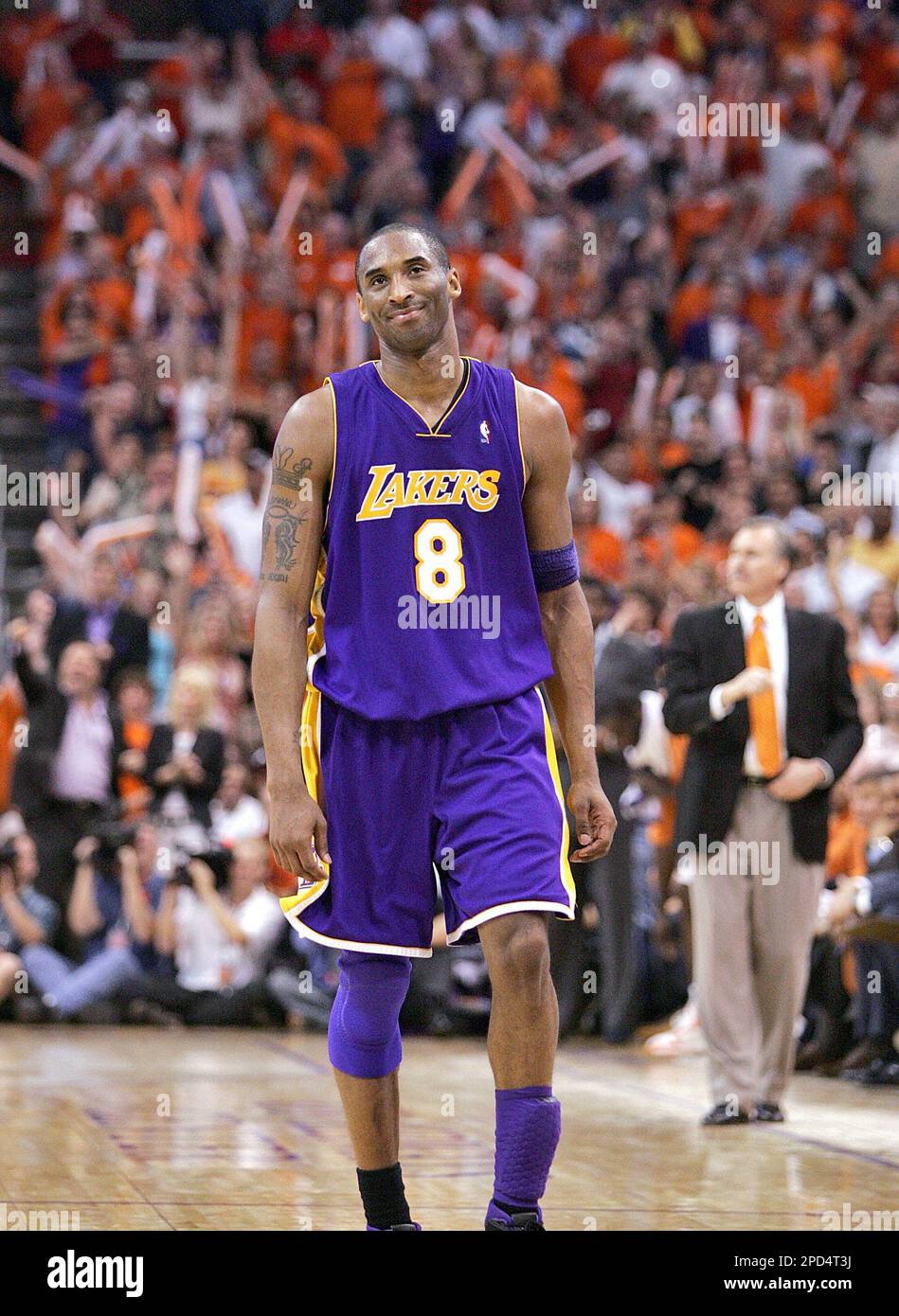 Los Angeles Lakers' Kobe Bryant walks off the court after being