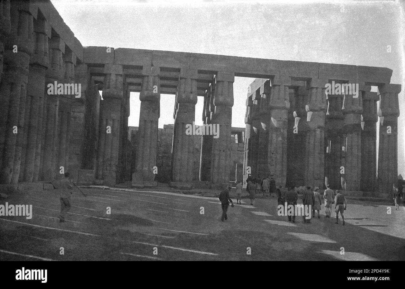 circa 1940s, historical, the ancient ruins at the Temple of Karnak, Luxor, Egypt. Picture shows visitors at the Great Hypostyle Hall in the Precinct of Amun-Ra, which at one time had a roof supported by 134 columns in 16 rows. Stock Photo