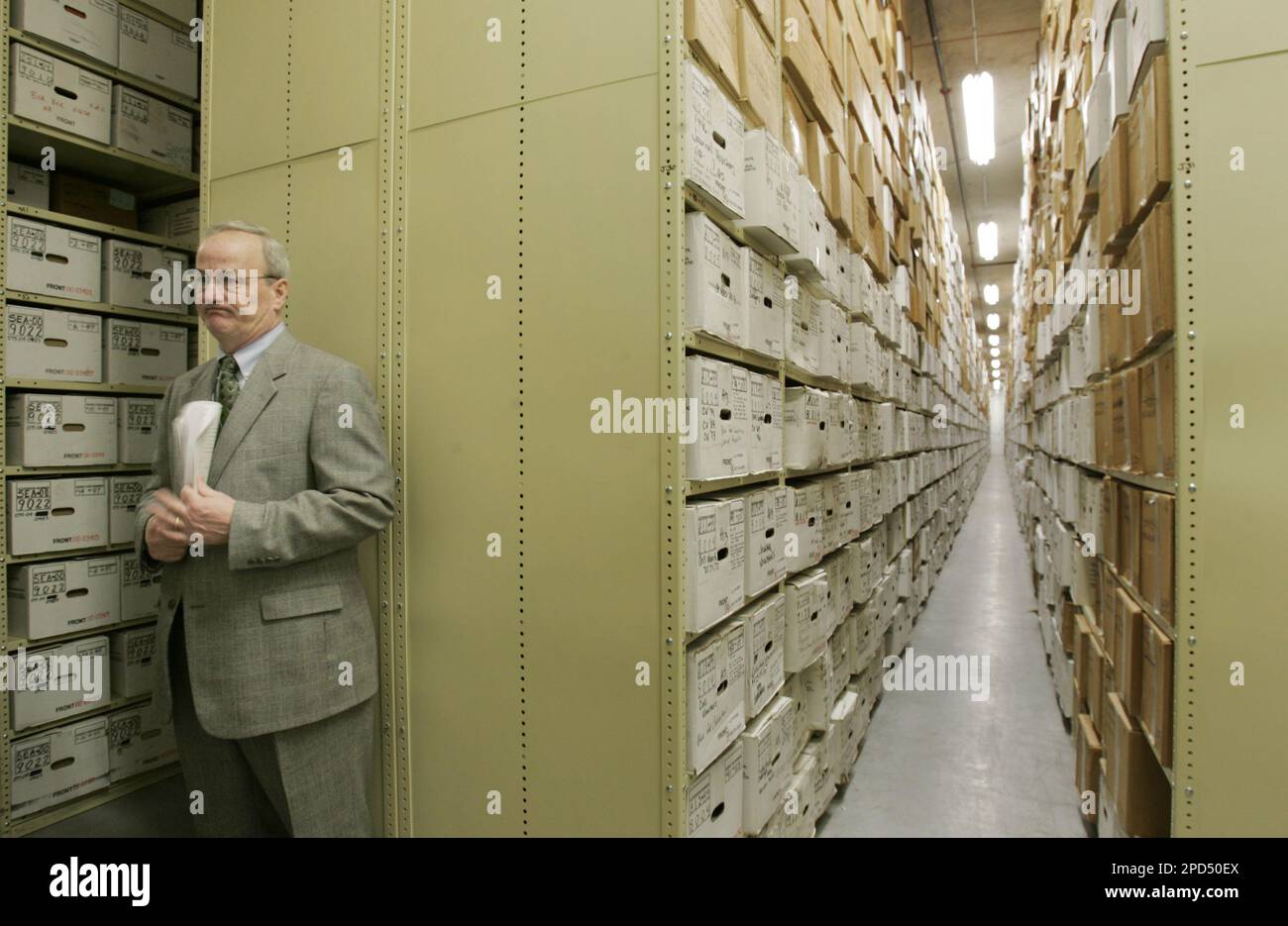 John Allshouse, assistant regional administrator for the National Archives, stands among the