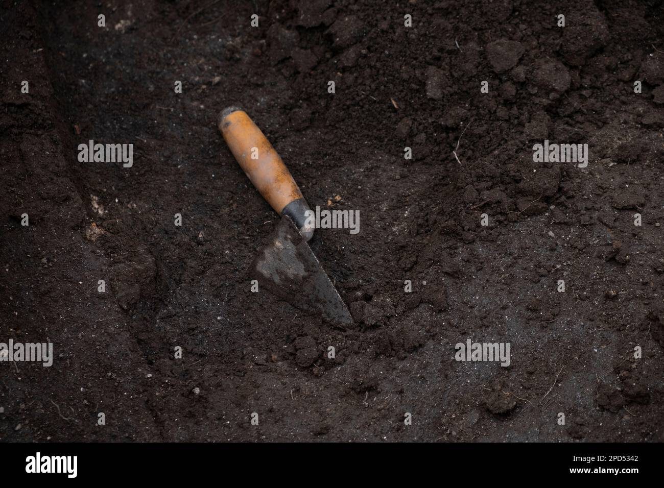 trowel on the ground in an archaeological excavation, work tools Stock