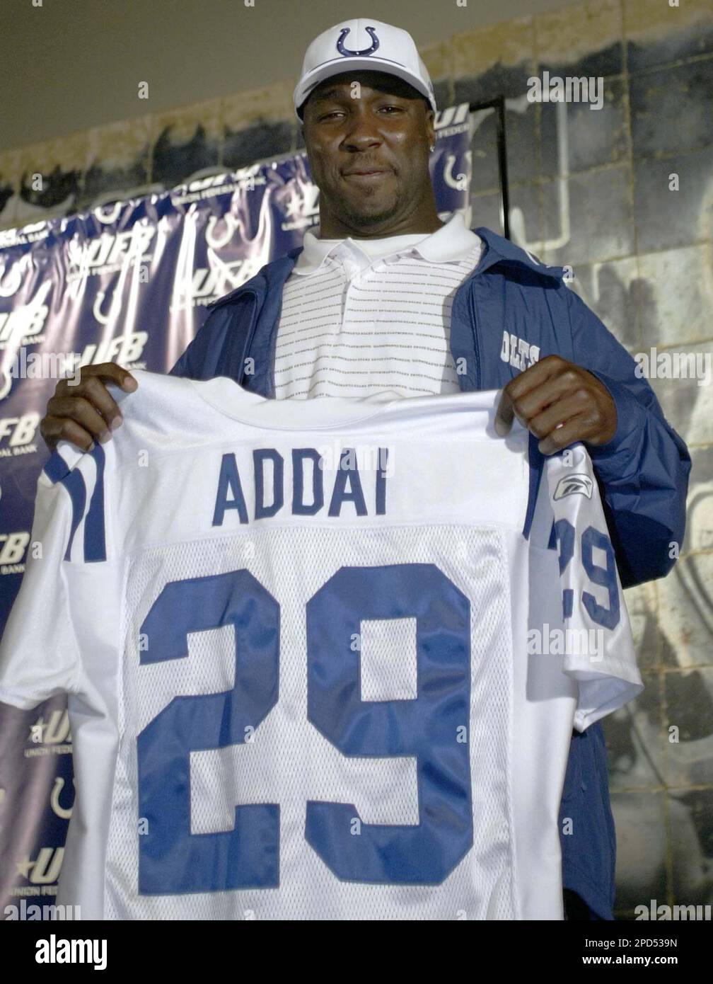 Running back Joseph Addai poses with his jersey after being