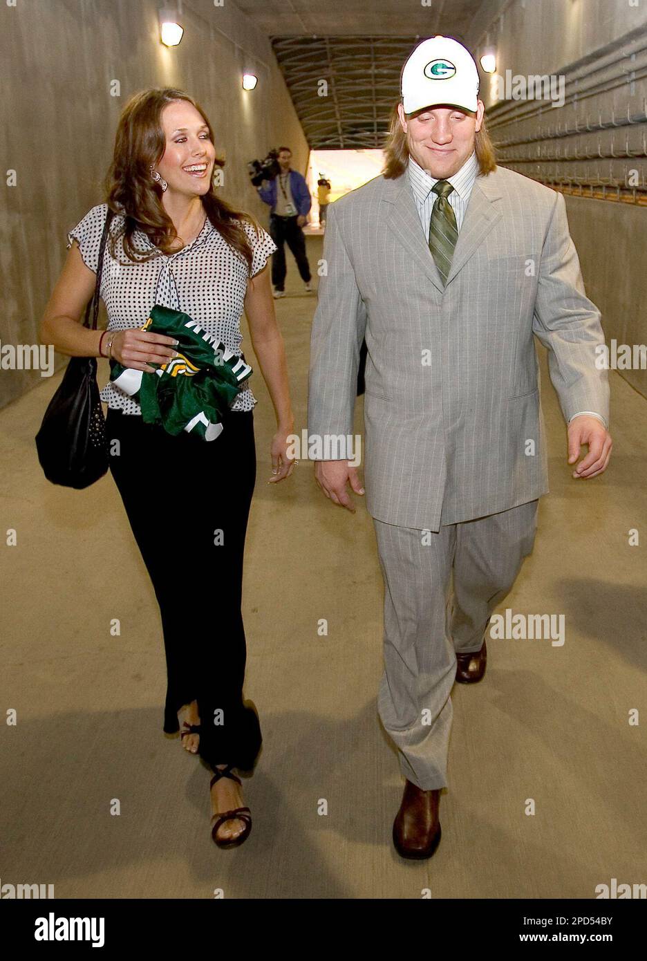 With his fiancee, Laura Quinn, at his side, Green Bay Packers first-round  draft pick A.J. Hawk walks down a tunnel after looking at Lambeau Field on  Saturday night, April 29, 2006, in