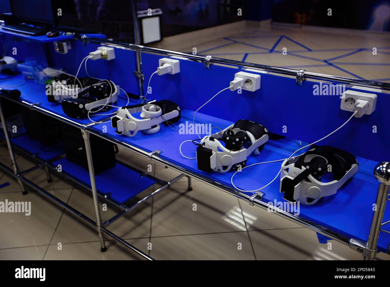 Many virtual reality (VR) sets are charging in VR room Stock Photo Alamy