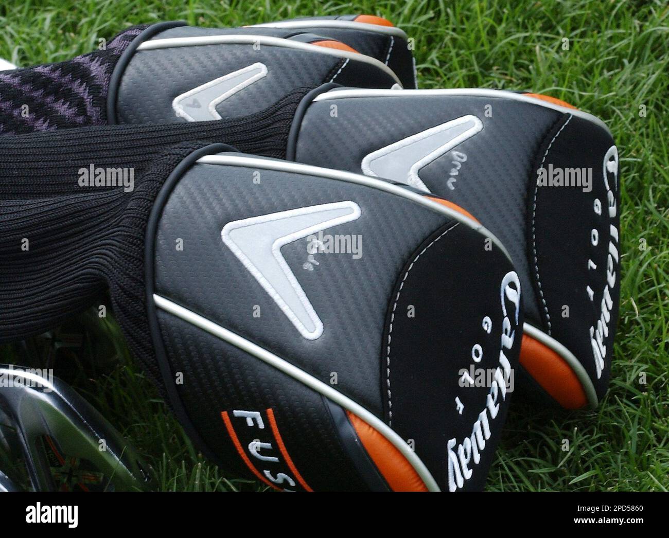 The head covers of Phil Mickelson's drivers are labeled fade and draw