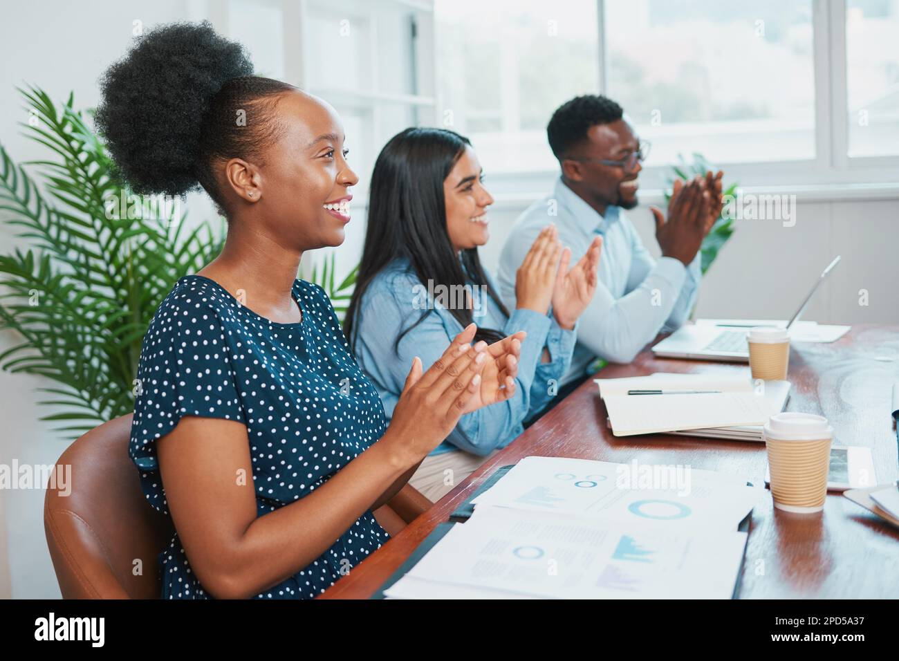 Colleagues clap at boardroom meeting, celebrate success good results Stock Photo