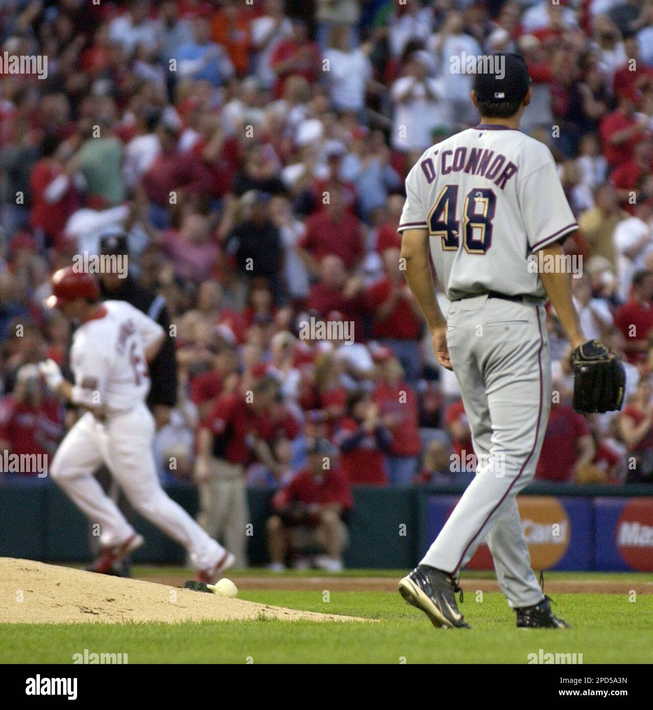 Washington Nationals' Mike O'Connor (48) watches as St. Louis Cardinals' Jim  Edmonds, far left, circles the bases after he hit a first-inning, three-run  home run on Thursday, April 27, 2006, at Busch