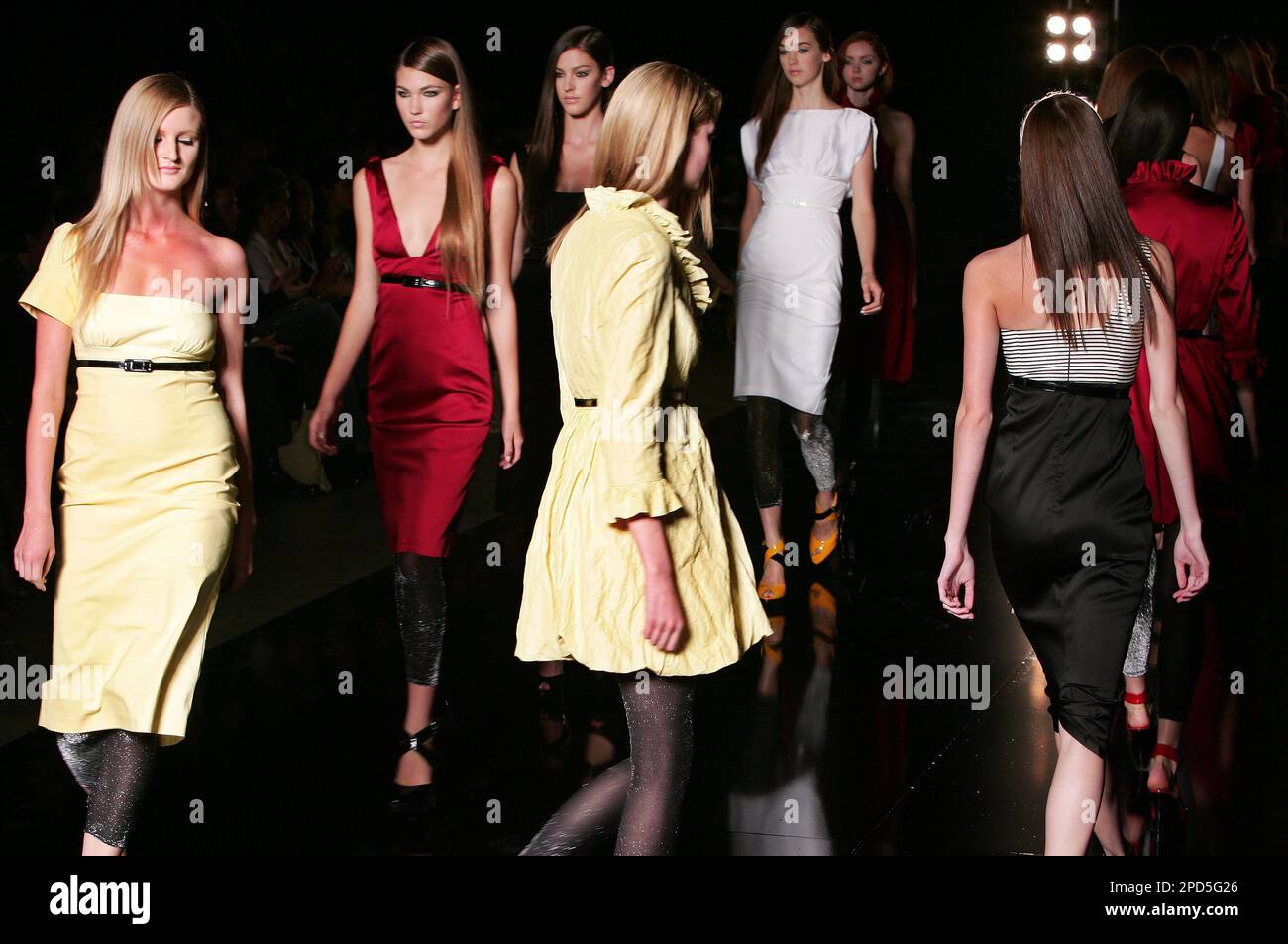 Models walk the catwalk in dresses by Australian designer Charlie Brown at  Australian Fashion Week in Sydney, Wednesday, April 26, 2006. Over one  hundred designers from Australia and Asia Pacific are showing