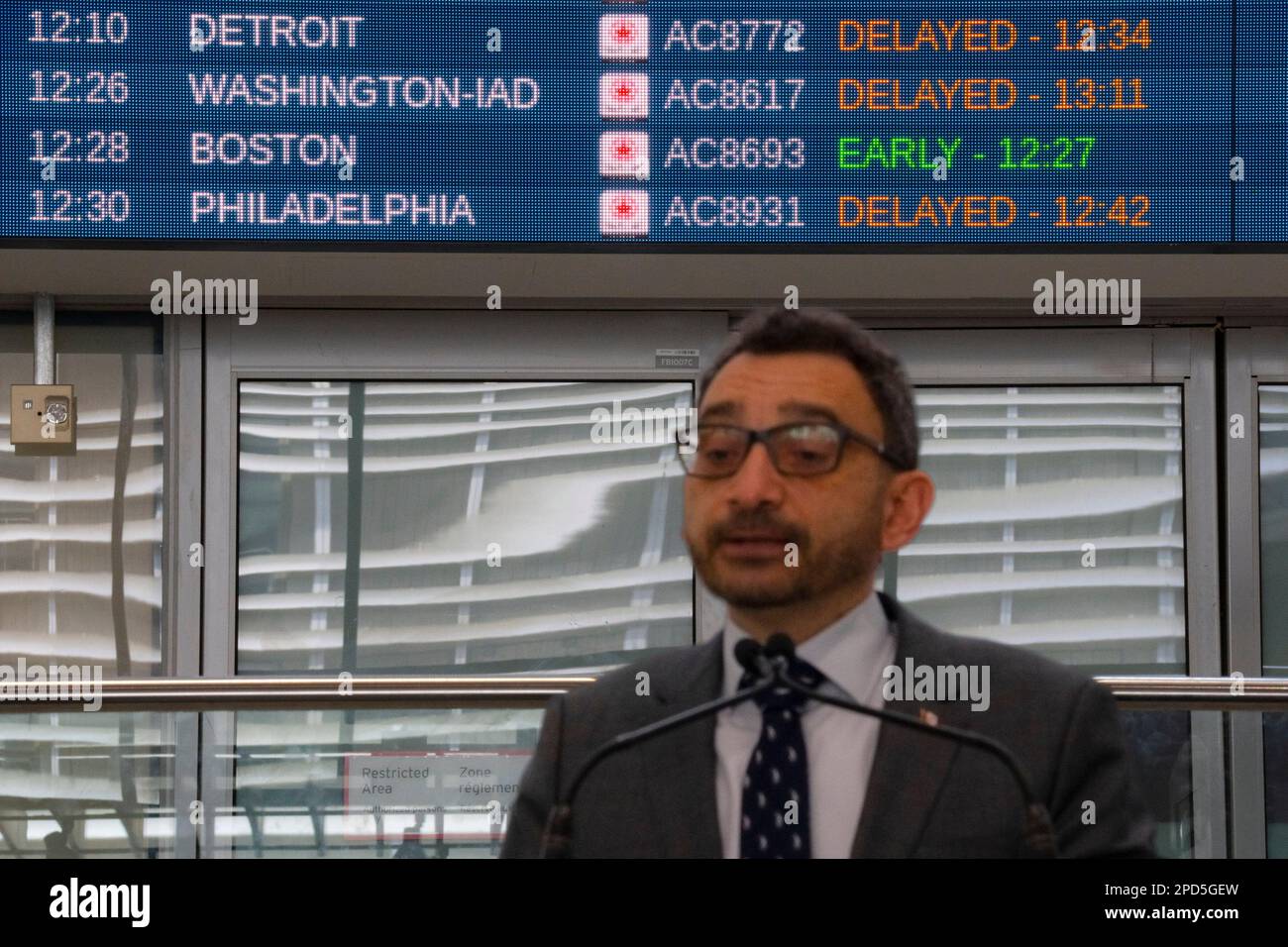 Flight status are displayed at the arrivals terminal at Pearson