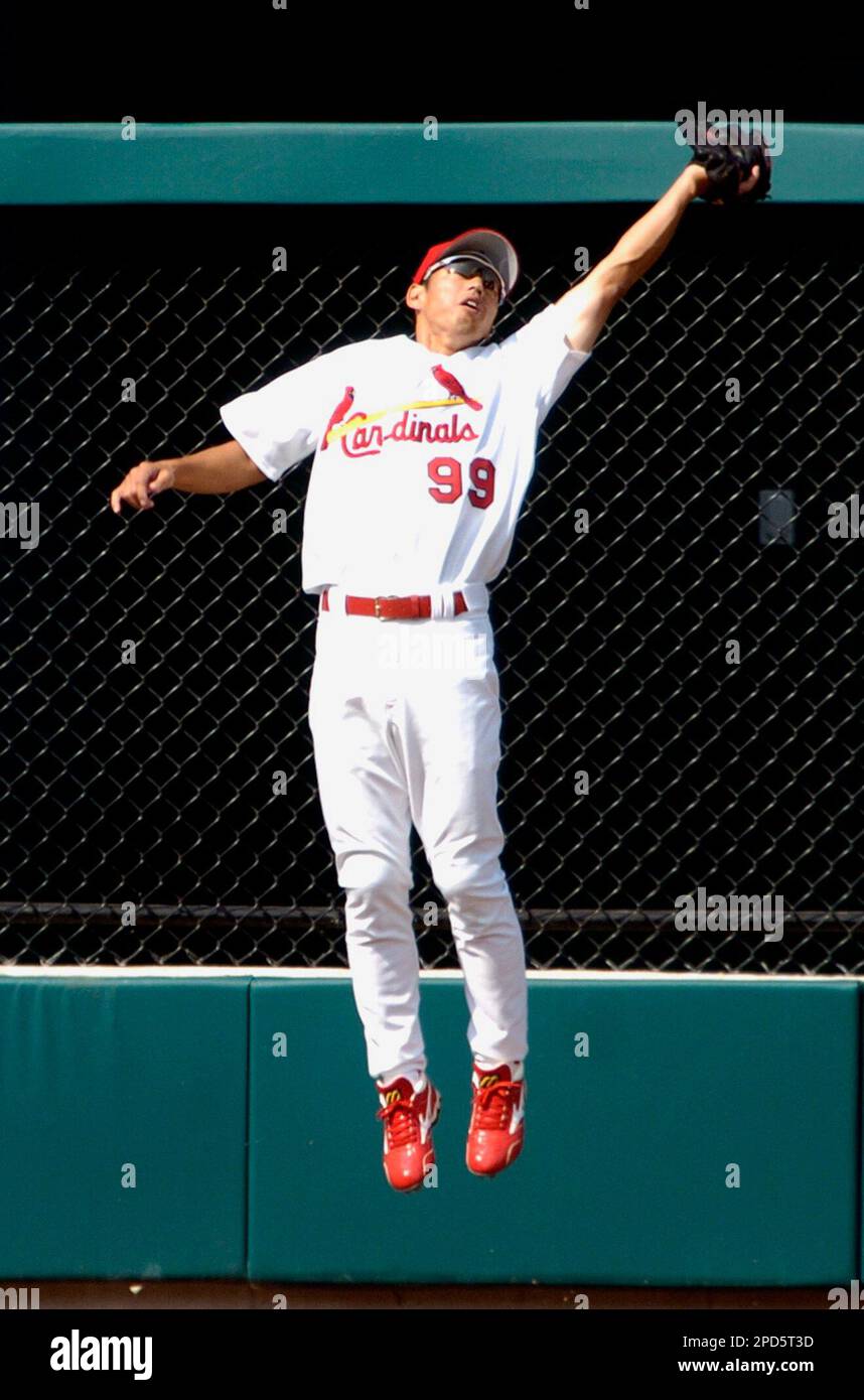 St. Louis Cardinals Jim Edmonds makes a diving attempt at a baseball off  the bat of Pittsburgh Pirates J.J. Furmaniak in the seventh inning at Busch  Stadium in St. Louis on September