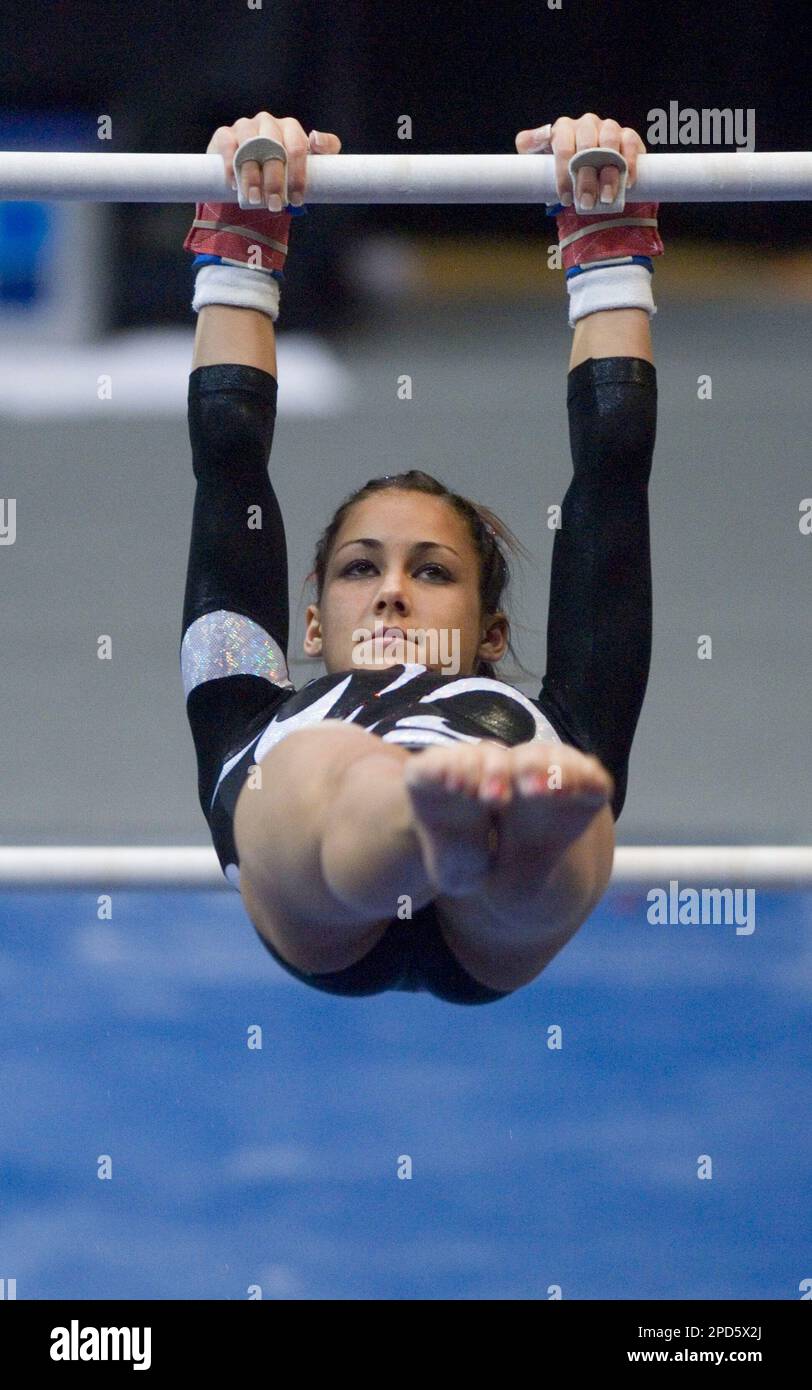 Utah's Kristina Baskett leads the Utes on the uneven parallel bars at the  NCAA Gymnastics National Championships in Corvallis, Ore., Friday April 21,  2006. Utah finished second in the championships. (AP Photo/Ryan