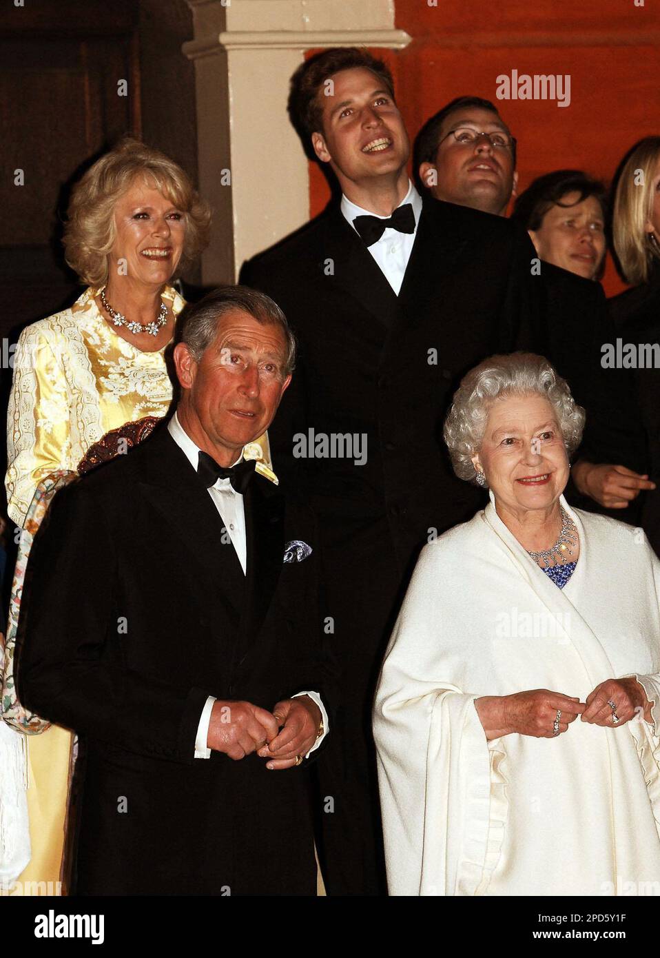 Britain's Queen Elizabeth II stands with Prince Charles, front