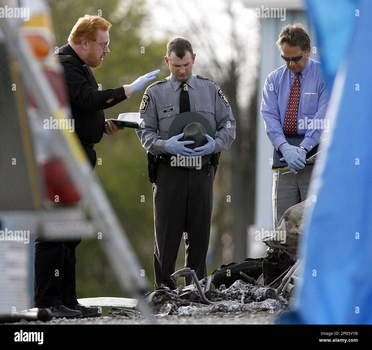 A Pennsylvania State Trooper, center, and Lebanon County Deputy Coroner
