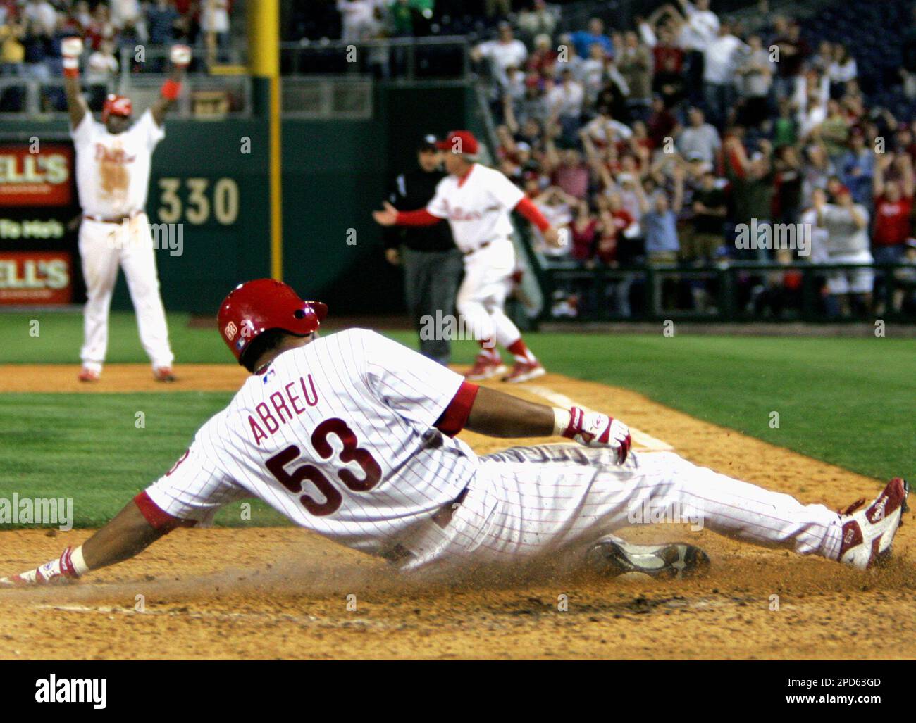 Philadelphia Phillies' Bobby Abreu slides home for an inside-the-park homer  against the New York Mets in the second inning Friday, May 14, 1999 in  Philadelphia. (AP Photo/ George Widman Stock Photo 