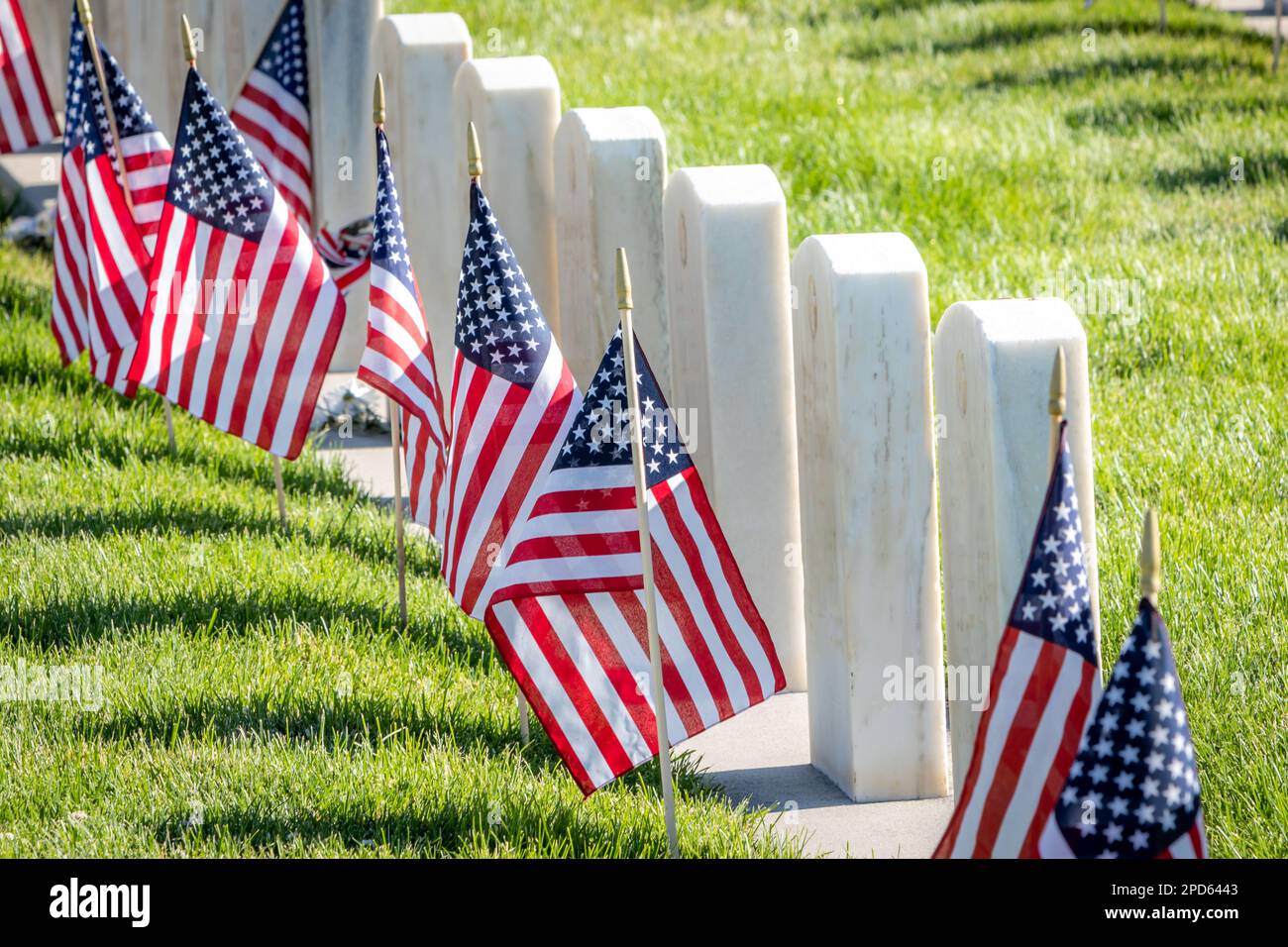 Military headstones honoring armed forces servicemen decorated with