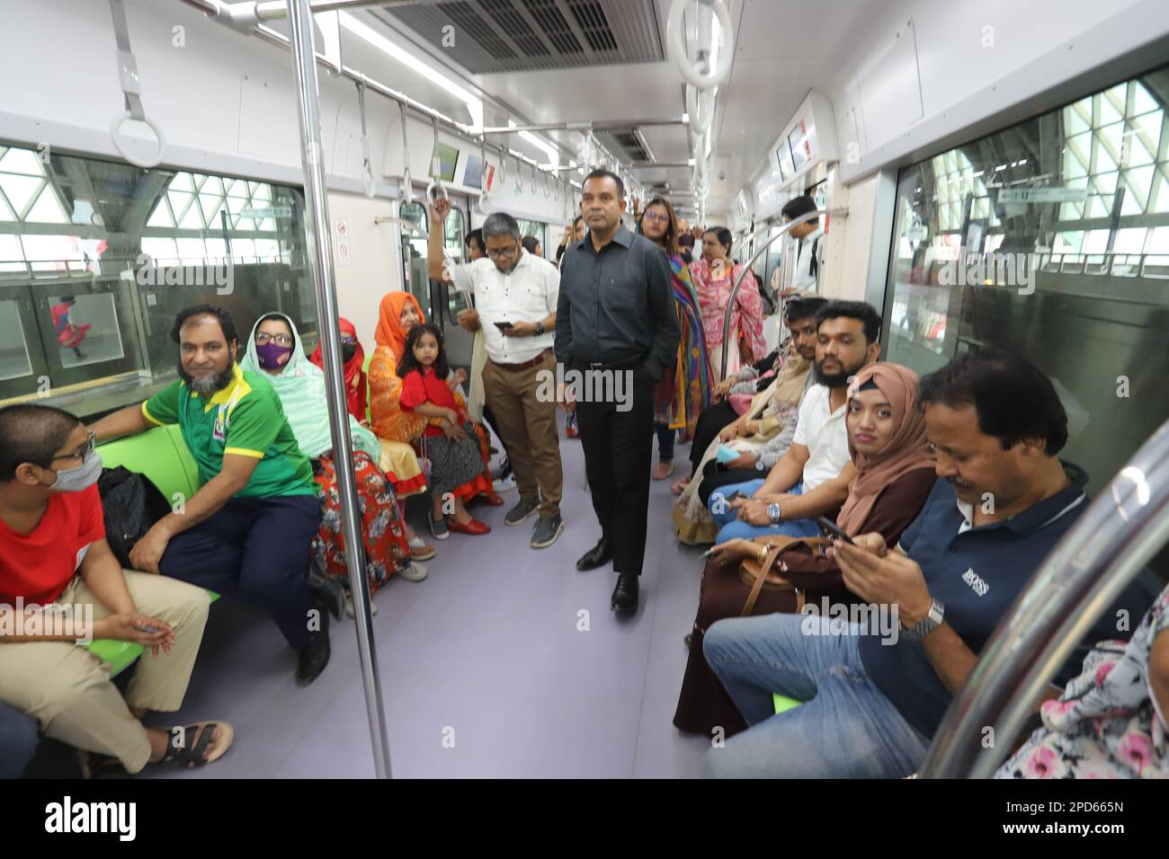 Passengers, mostly people who wanted to get a new experience, travel by metro train as the new transport service opens to the public Dhaka Bangladesh Stock Photo