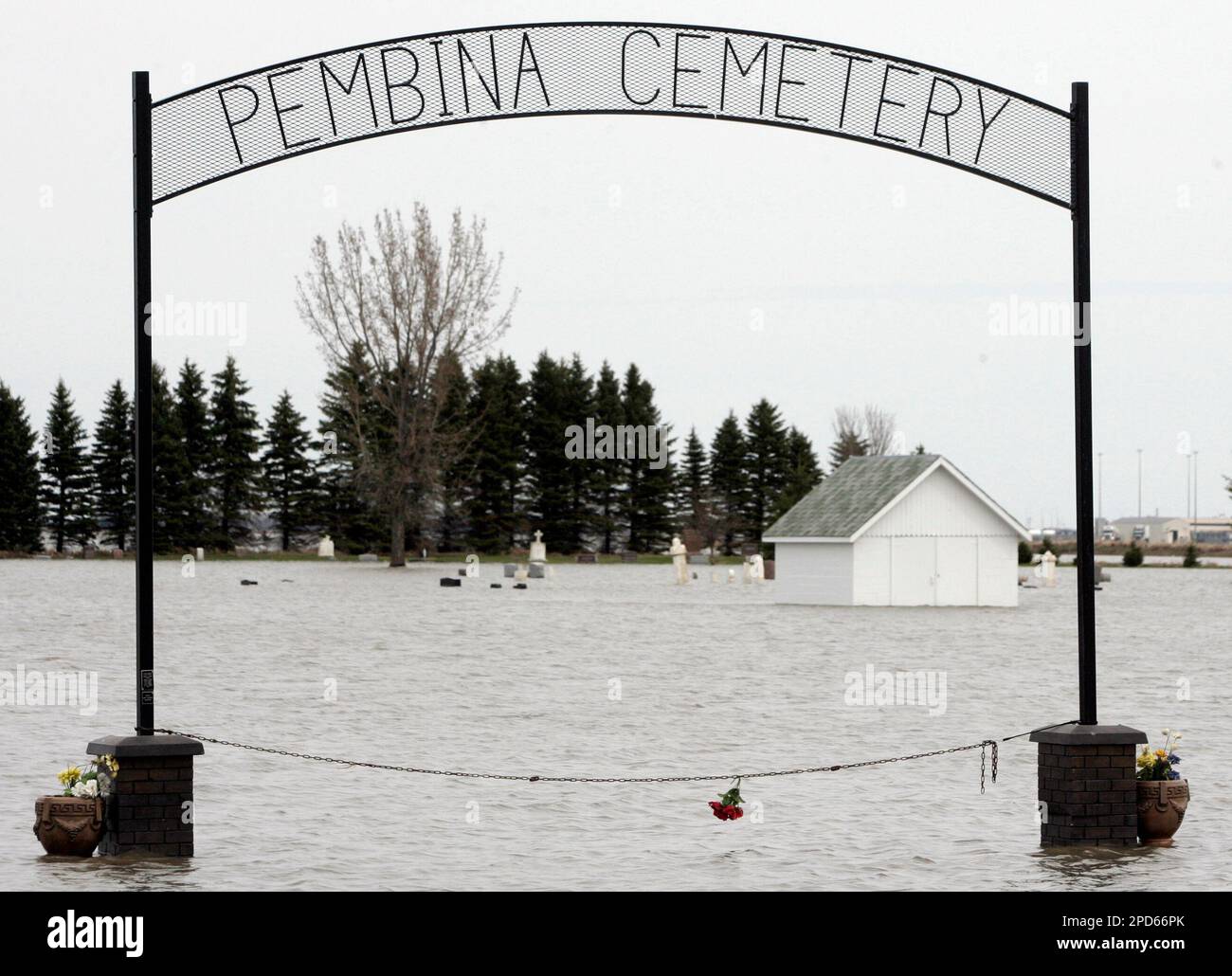 The gates and the entire Pembina cemetery are under floodwaters on the