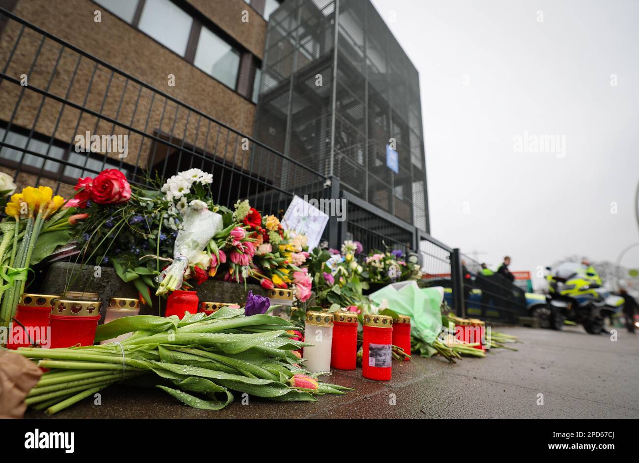 Hamburg, Germany. 13th Mar, 2023. Flowers and candles in front of the entrance of a community center of Jehovah's Witnesses. Credit: Christian Charisius/dpa/Alamy Live News Stock Photo