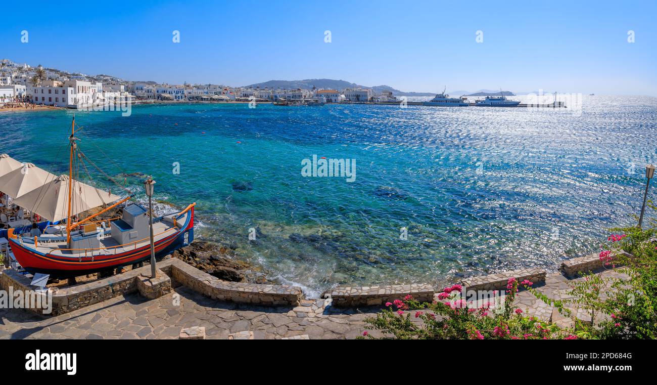 Panoramic view of the old port of Mykonos in Greece. Walkway on the marina. Stock Photo